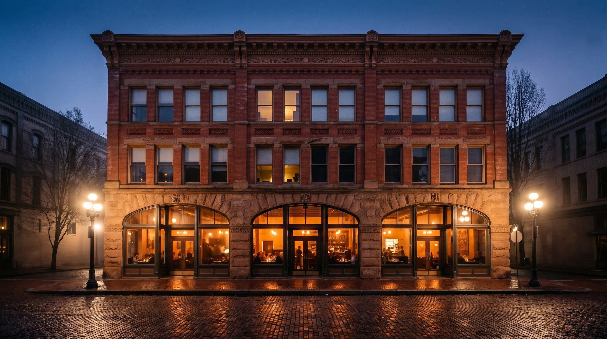 The brick building on Occidental Avenue at dusk